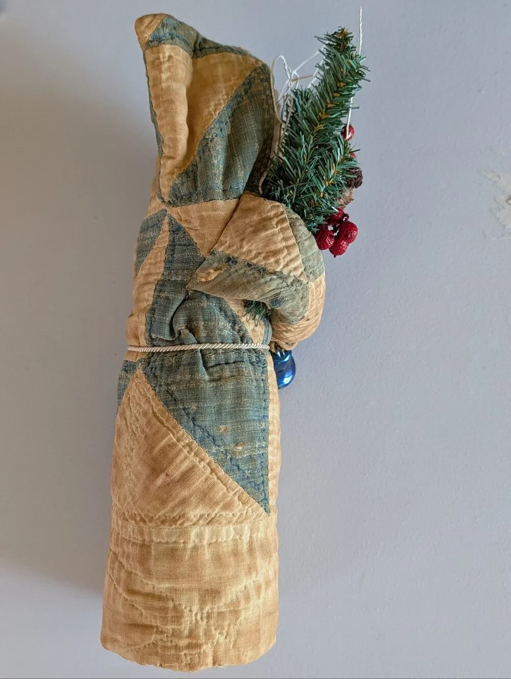 FOLK ART SANTA CLAUS wearing an antique quilt